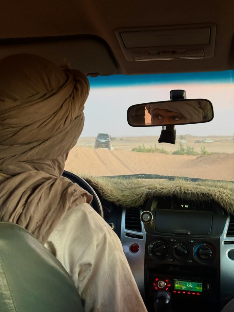 View from inside a vehicle with a local guide driving through the Moroccan desert.